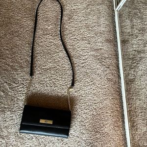 Small black purse with long strap